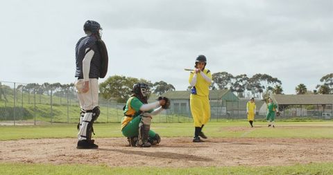 Diverse Softball Team Preparing for Play Outdoors