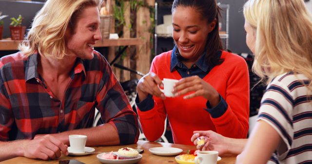 Diverse Group of Friends Enjoying Coffee and Pastries at Cafe - Download Free Stock Images Pikwizard.com