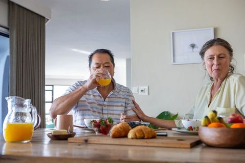 Relaxed Morning: Senior Couple Enjoying Breakfast Together