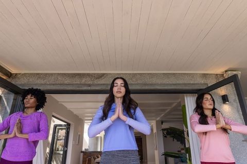 Diverse Wellness Group Meditating in Contemporary Home Environment