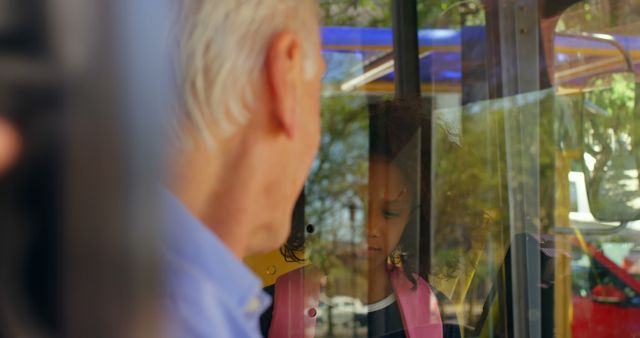 Elderly Man Looking at Young Girl Through Window - Download Free Stock Images Pikwizard.com