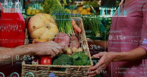 Farmers market produce with financial data overlay, vendor selecting tomato from wicker basket