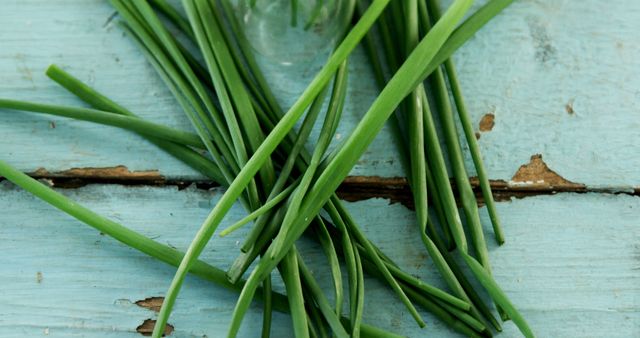 Fresh Chives on Rustic Blue Wooden Background with Copy Space - Download Free Stock Images Pikwizard.com