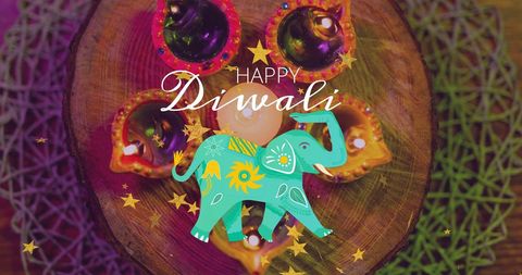 Vivid diwali celebrations with elegant candle decor featuring festive elephant art