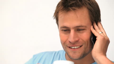 Smiling Relaxed Man Talking on Mobile Phone