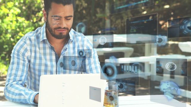 Man working on laptop outdoors with virtual data interfaces overlaying. For themes of remote work, modern technology, outdoor workspaces, virtual communication, and digital interfaces.