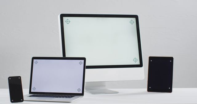 Image of laptop, smartphone, tablet and computer on white table with copy space in office - Download Free Stock Photos Pikwizard.com