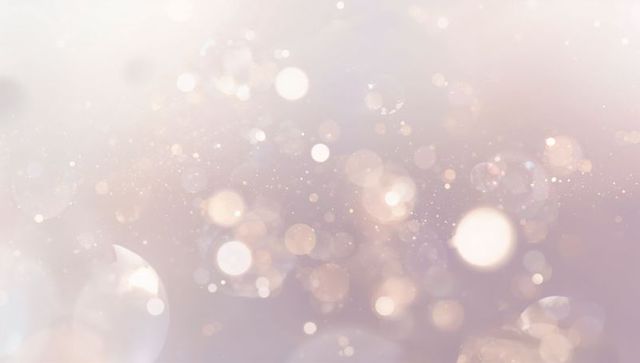 Pastel bokeh light field with soft sparkles, glowing orbs and subtle rose gold gradient glow