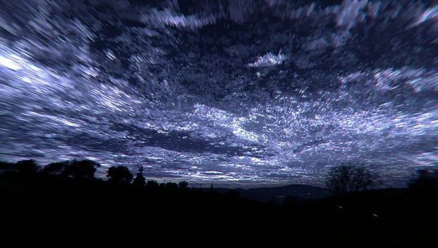 Streaking Milky Way Over Silhouetted Rural Landscape