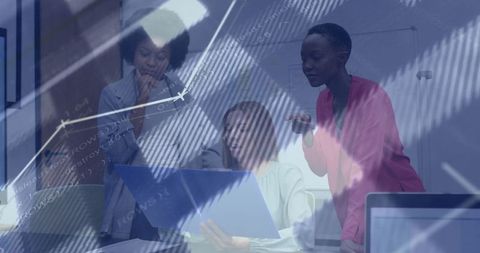Businesswomen Analyzing Data with Digital Code Overlay