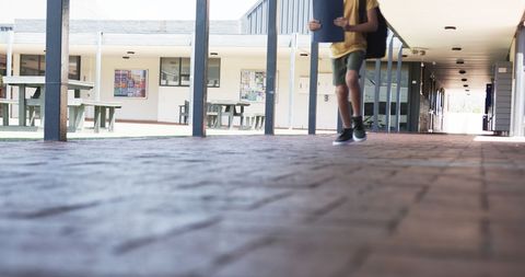 Student Walking in School Corridor on Brick Pathway - Download Free Stock Images Pikwizard.com