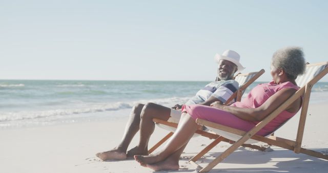 Elderly Couple Enjoying Relaxing Beach Day in Wooden Deck Chairs - Download Free Stock Images Pikwizard.com