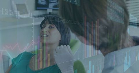 Dentist Examining Patient with Data and Technology Exchange