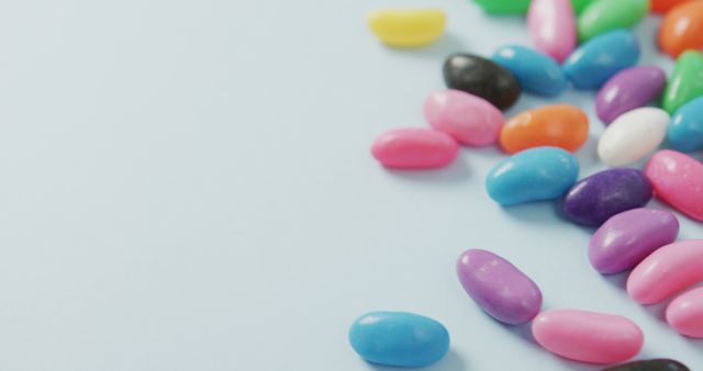 Colorful Jelly Beans on Blue Background - Download Free Stock Images Pikwizard.com