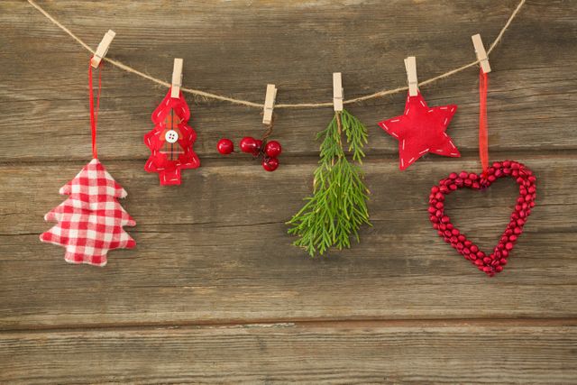 Christmas decorations hanging against wooden wall - Download Free Stock Photos Pikwizard.com