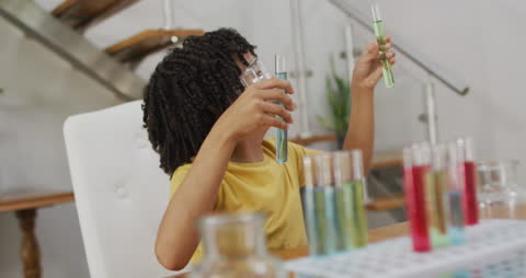 Curious Schoolboy Exploring Science with Test Tubes
