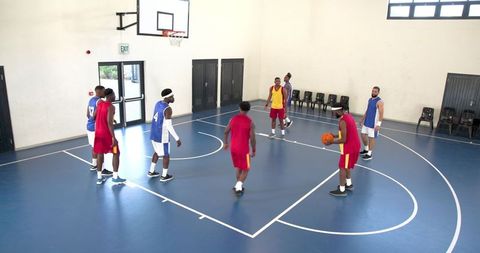 Diverse Male Basketball Teamman Navigating Game Strategies Indoors