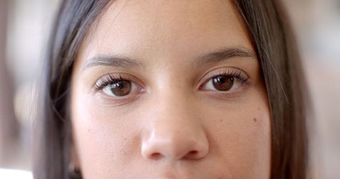 Close-Up of Young Woman with Brown Eyes and Long Eyelashes