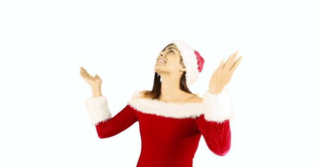 Joyful Woman Celebrating Christmas in Santa Hat and Red Dress - Download Free Stock Images Pikwizard.com