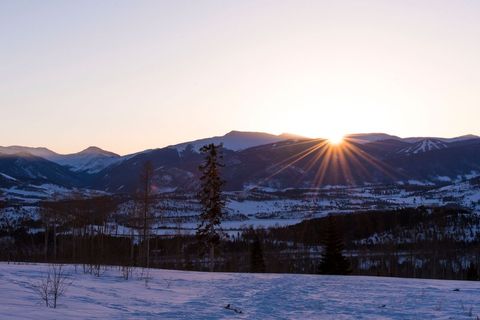 Serene Winter Sunrise Over Snowy Mountains and Valleys