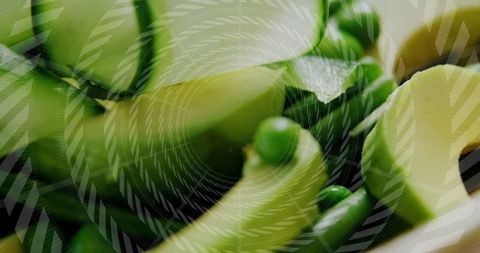 Spiral vegetable ribbons with green peas in minimalist graphic background