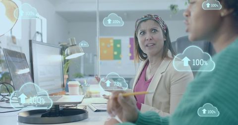 Diverse coworkers analyzing data through cloud technology