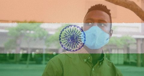 Man in Face Mask Showing India Flag Healthcare Concept