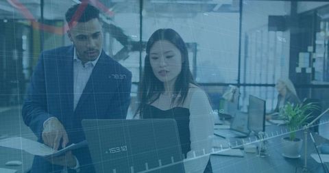 Business Professionals Analyzing Data Together in Modern Office