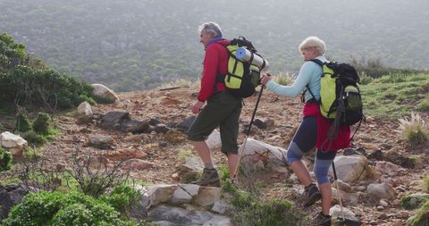 Senior Couple Trekking in Mountainous Landscape - Download Free Stock Images Pikwizard.com
