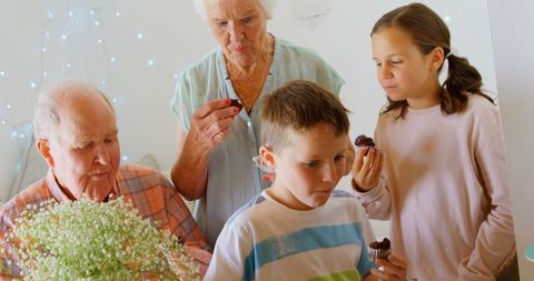 Multi-Generation Family Enjoying Cupcakes Together