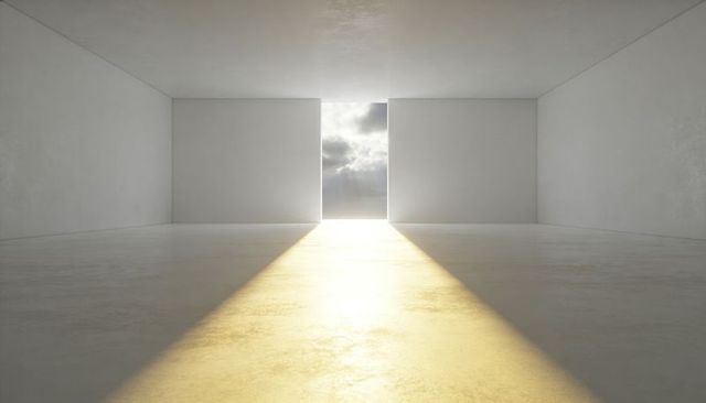 Minimalist architectural hall revealing dramatic central opening and golden sunbeam