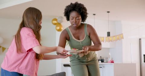 Couple Cleaning Up After Celebrating Birthday at Home