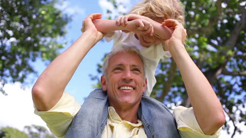 Father and Son Enjoying Playful Day in Park