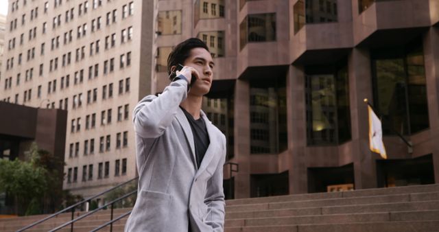 Handsome Business Man Walking in Urban Area Taking a Phone Call - Download Free Stock Images Pikwizard.com