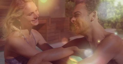 Joyful Couple Relaxing by Sunlit Pool