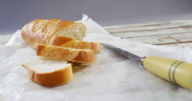 Sliced Baguette on Rustic Wooden Table - Download Free Stock Images Pikwizard.com