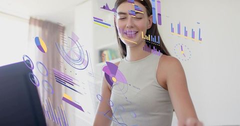 Young woman interacting with holographic data visualization and ar analytics dashboards