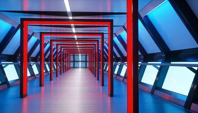 Futuristic Skybridge Corridor Featuring Repeating Red Arch Frames and Cyan LED Glow