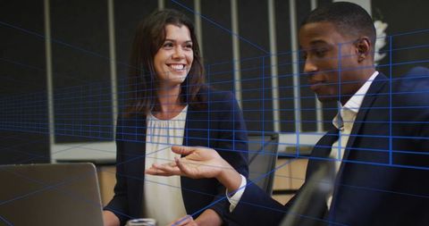 Businessman and businesswoman discussing digital trends