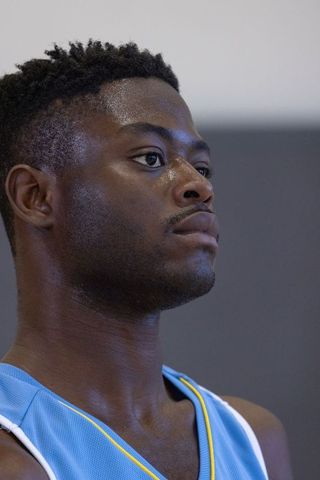 Focused African American Athlete in Blue Jersey Gaze