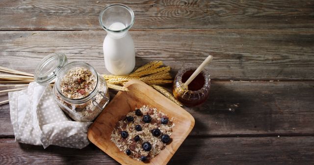 Healthy Breakfast Setup Featuring Oatmeal, Blueberries, Honey, and Milk - Download Free Stock Images Pikwizard.com