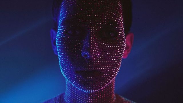 Projection Mapped LED Dots on Human Face in Futuristic Setting