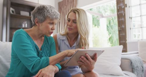 Elderly Mother and Adult Daughter Connecting Over Tablet - Download Free Stock Images Pikwizard.com