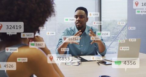 Man gesturing and presenting with digital notification overlays during office meeting
