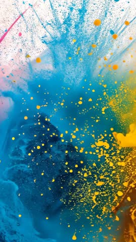 Vertical paint explosion video with vibrant blue yellow pink clouds splashing motion