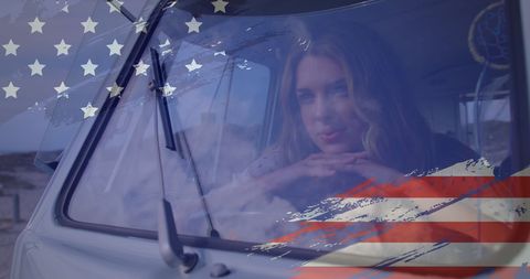 Woman Dreamily Gazing Through Car Window with American Flag Overlay