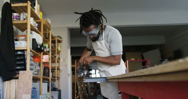 Focused Craftsman Polishing Metal in Workshop - Download Free Stock Images Pikwizard.com