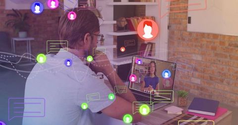 Man Engaging with Social Media Icons Overlay on Laptop Screen