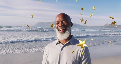 Senior Man Smiling on Beach with Digital Stars Overlay
