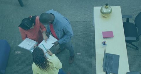 Creative Office Collaborators Reviewing Documents Together